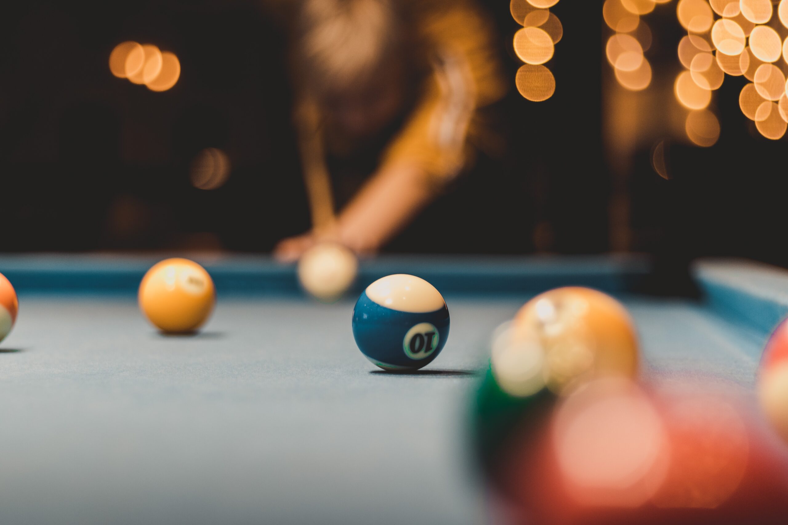 Playing pool on a professional table in a games room