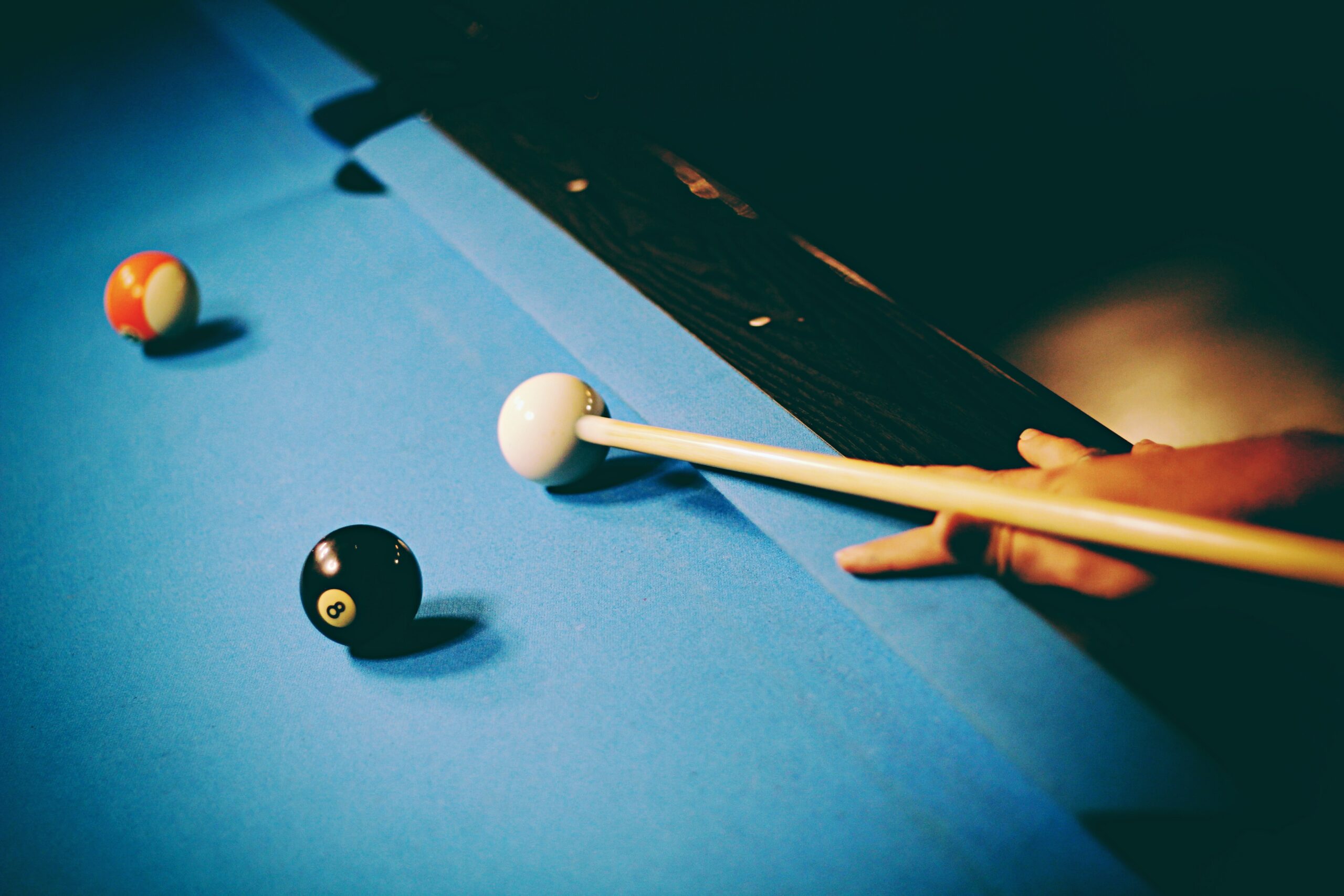 pool tables with universal tr triangle rack and cue player on blue cloth