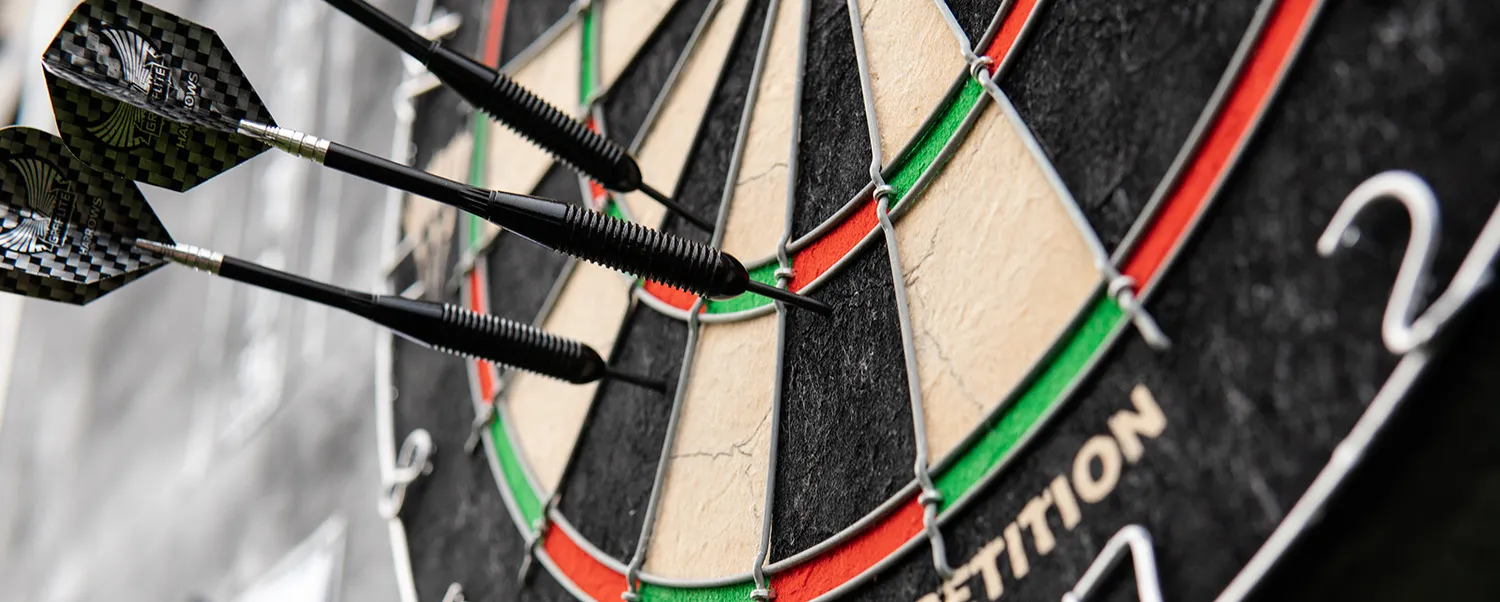dartboard with three darts in